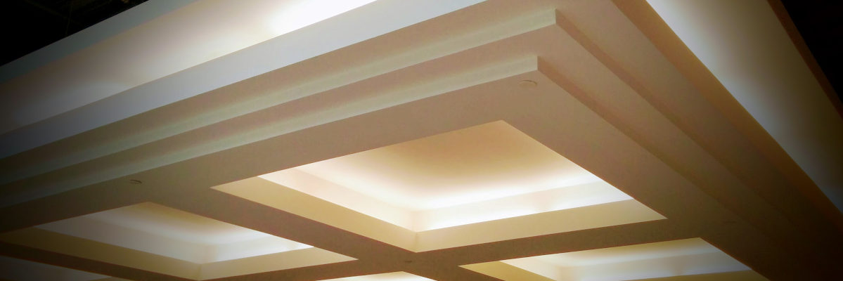 Coffered drywall ceiling with warm recessed lighting