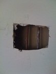 Picture of hole drywall hole for copper pipe access